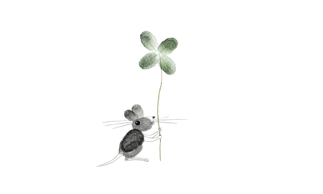 Mouse with a four leaf clover